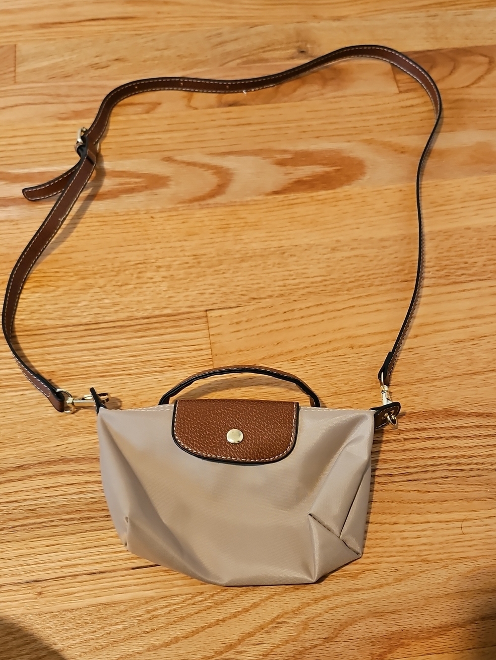 Compact Taupe Crossbody Bag with Brown Trim